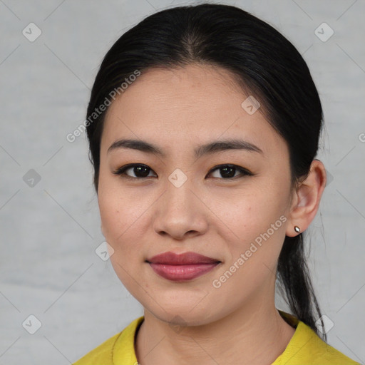 Joyful asian young-adult female with medium  brown hair and brown eyes