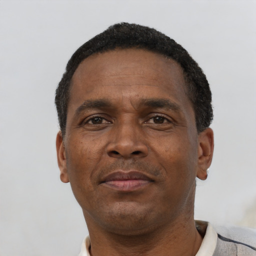 Neutral black adult male with short  black hair and brown eyes