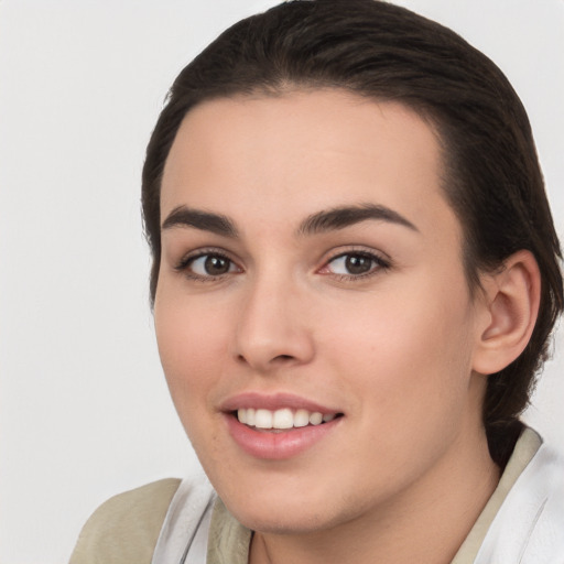 Joyful white young-adult female with medium  brown hair and brown eyes