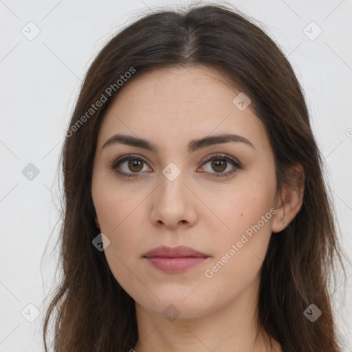 Neutral white young-adult female with long  brown hair and brown eyes