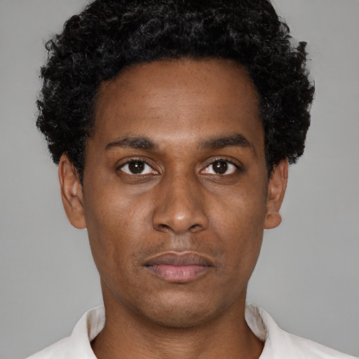 Neutral latino young-adult male with short  brown hair and brown eyes