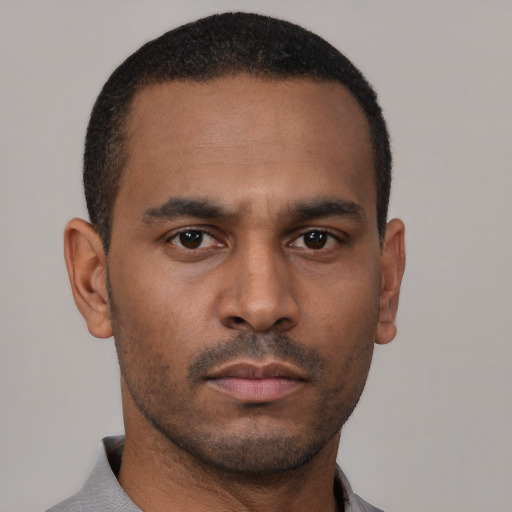 Neutral latino young-adult male with short  brown hair and brown eyes