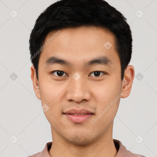 Joyful asian young-adult male with short  black hair and brown eyes