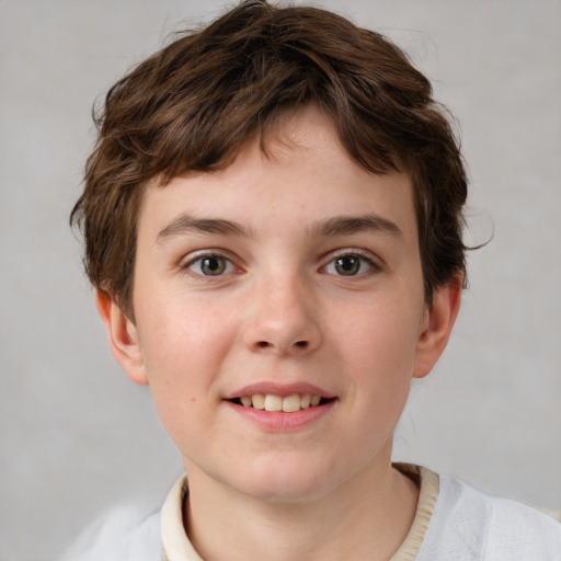 Joyful white child male with short  brown hair and brown eyes