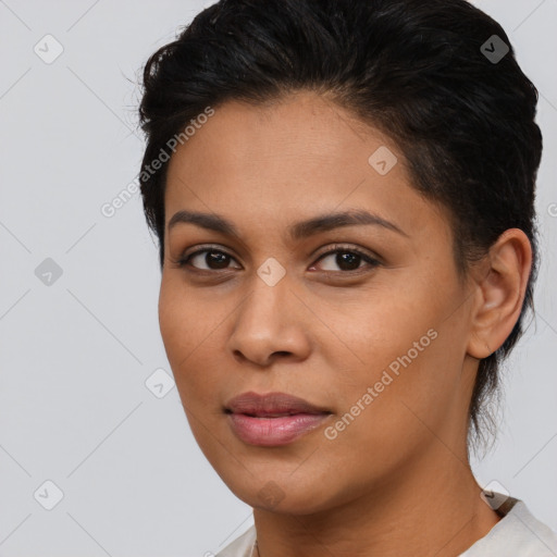 Joyful latino young-adult female with medium  brown hair and brown eyes