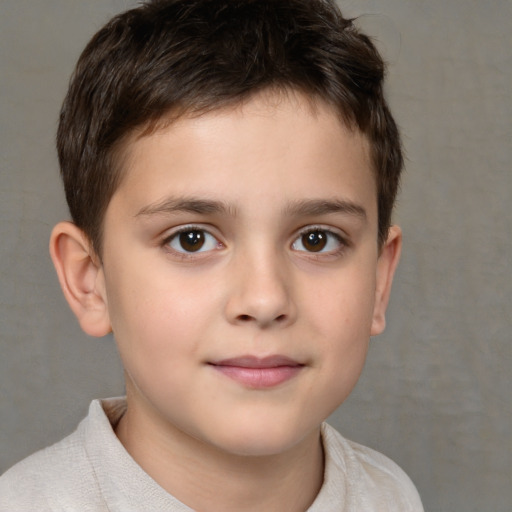 Joyful white child male with short  brown hair and brown eyes