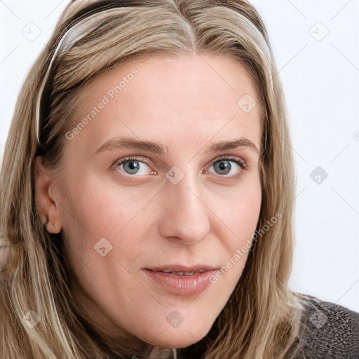 Joyful white young-adult female with long  brown hair and blue eyes