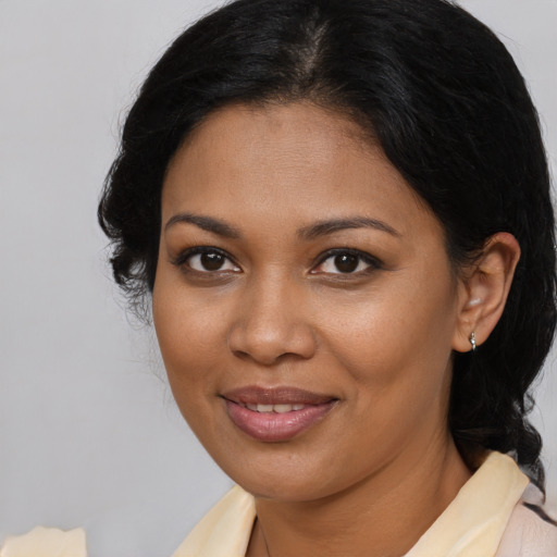 Joyful black young-adult female with medium  brown hair and brown eyes