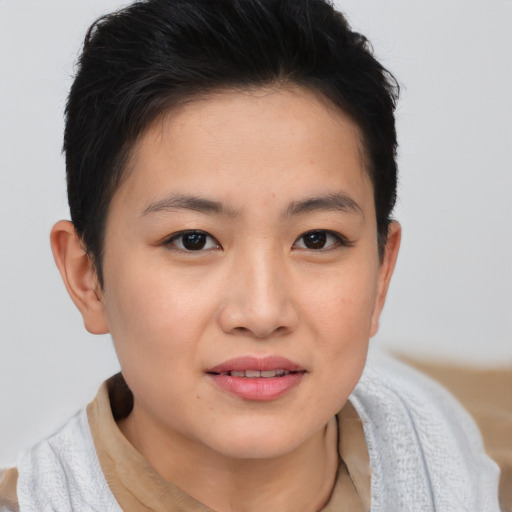 Joyful asian young-adult female with short  brown hair and brown eyes