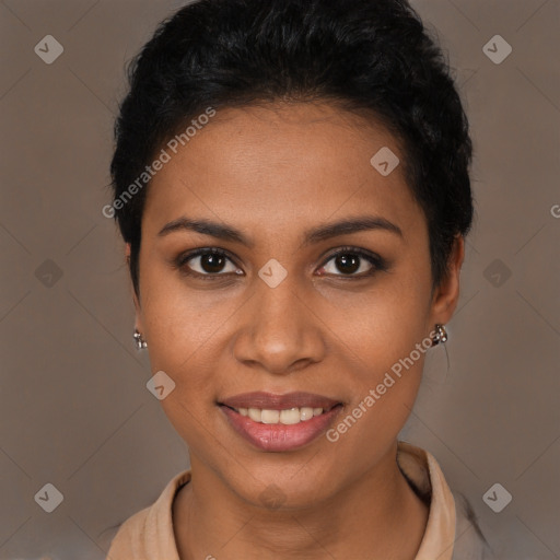 Joyful black young-adult female with short  brown hair and brown eyes