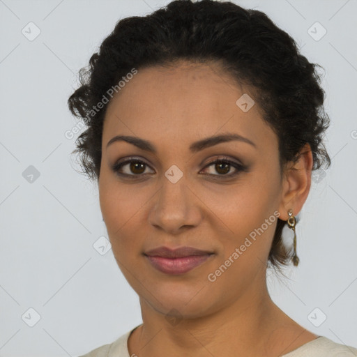 Joyful latino young-adult female with short  brown hair and brown eyes