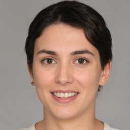 Joyful white young-adult female with short  brown hair and brown eyes