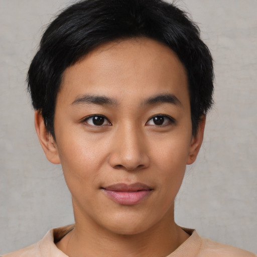 Joyful asian young-adult female with short  black hair and brown eyes