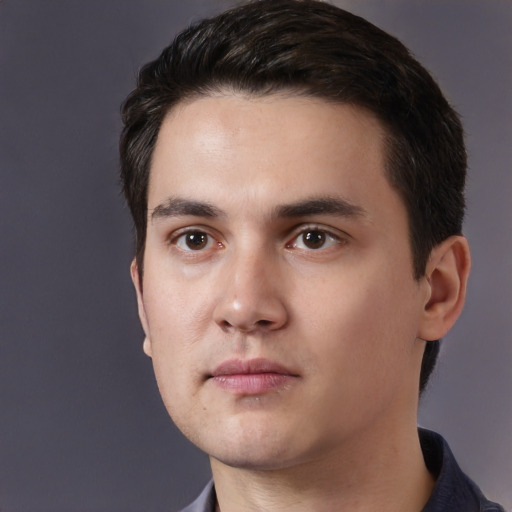Neutral white young-adult male with short  black hair and brown eyes