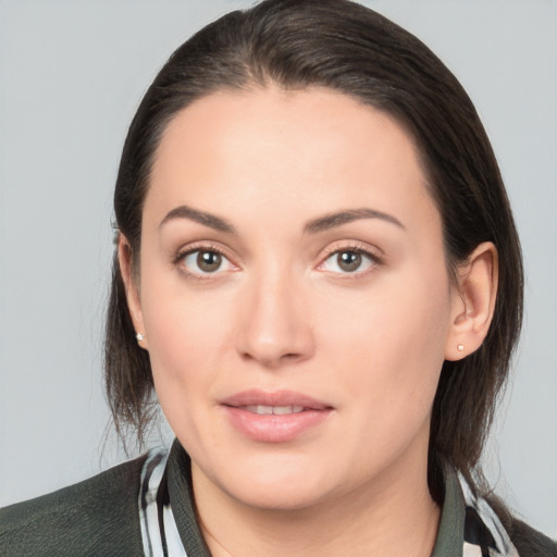 Joyful white young-adult female with medium  brown hair and brown eyes