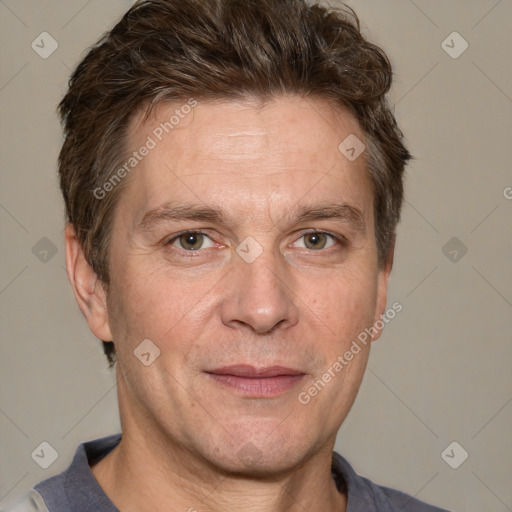 Joyful white adult male with short  brown hair and grey eyes