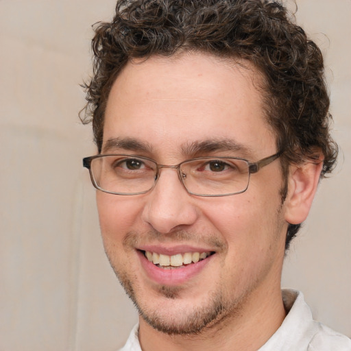 Joyful white adult male with short  brown hair and brown eyes