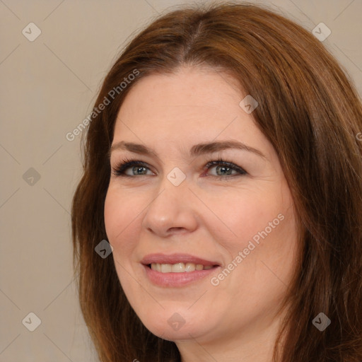 Joyful white adult female with medium  brown hair and brown eyes