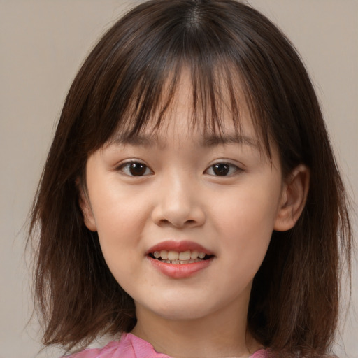 Joyful asian child female with medium  brown hair and brown eyes