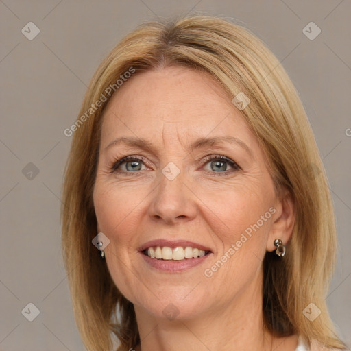 Joyful white adult female with medium  brown hair and grey eyes