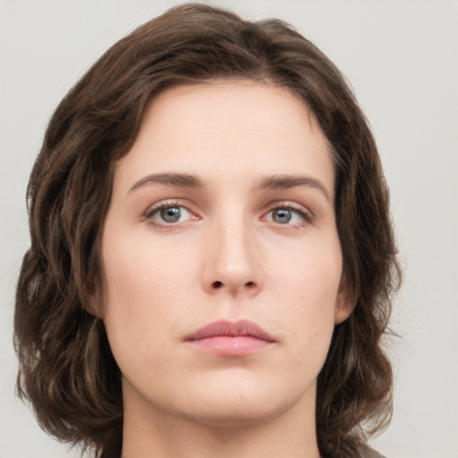 Neutral white young-adult female with medium  brown hair and green eyes