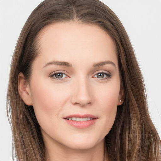 Joyful white young-adult female with long  brown hair and grey eyes