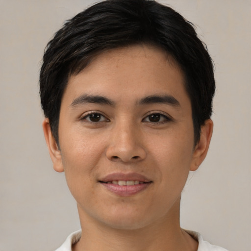 Joyful asian young-adult male with short  black hair and brown eyes