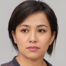 Neutral asian young-adult female with medium  brown hair and brown eyes