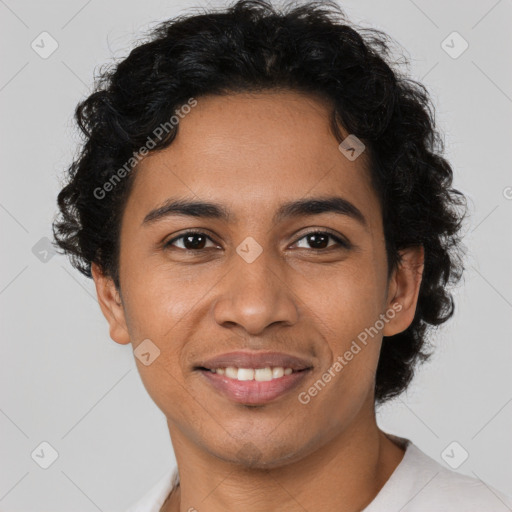 Joyful latino young-adult male with short  brown hair and brown eyes