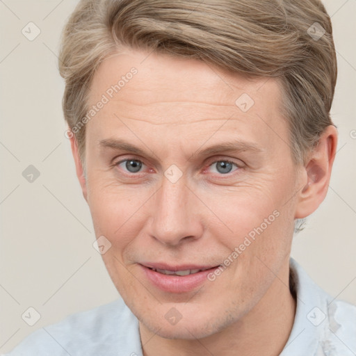 Joyful white adult male with short  brown hair and grey eyes