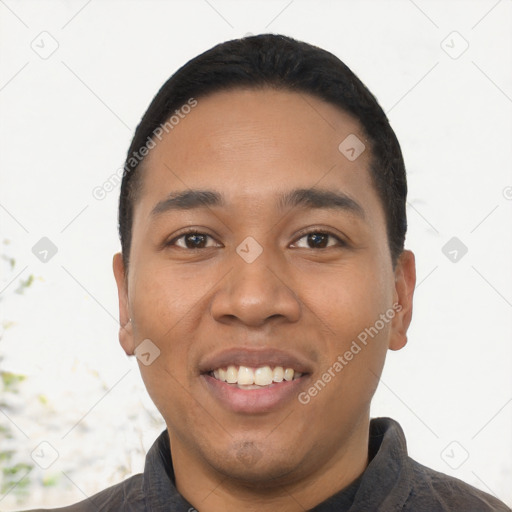 Joyful latino young-adult male with short  black hair and brown eyes