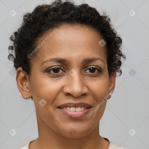 Joyful black adult female with short  brown hair and brown eyes