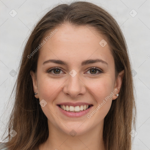 Joyful white young-adult female with long  brown hair and grey eyes