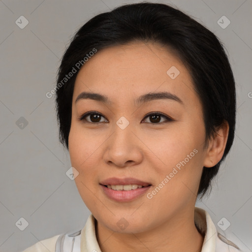 Joyful asian young-adult female with medium  brown hair and brown eyes