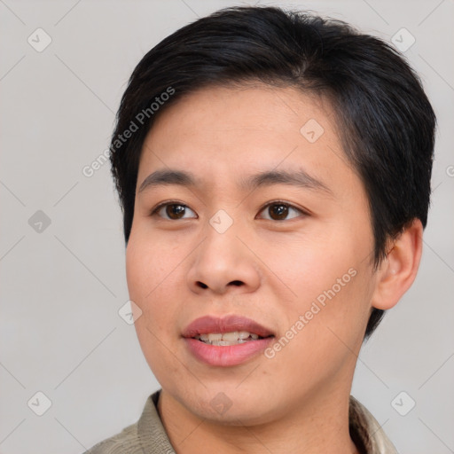 Joyful asian young-adult male with short  brown hair and brown eyes