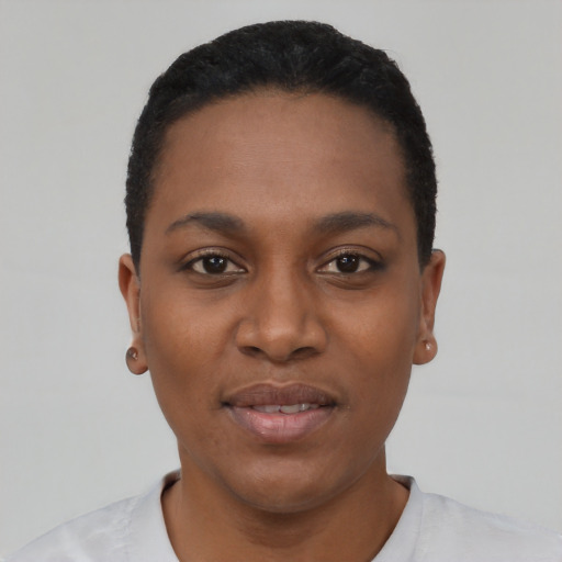 Joyful black young-adult female with short  black hair and brown eyes