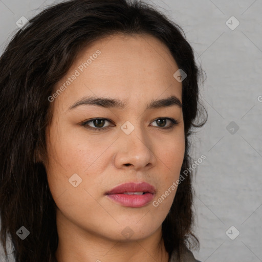 Joyful latino young-adult female with long  brown hair and brown eyes