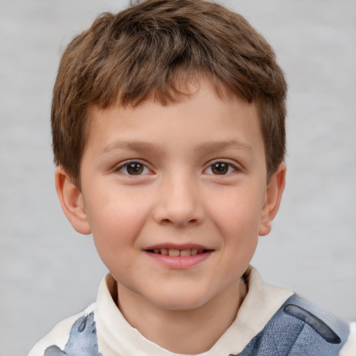 Joyful white child male with short  brown hair and brown eyes