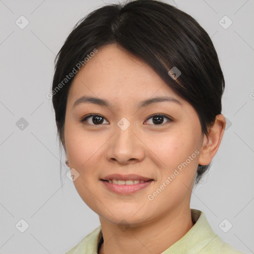 Joyful asian young-adult female with medium  brown hair and brown eyes