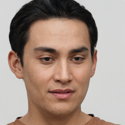 Joyful asian young-adult male with short  brown hair and brown eyes