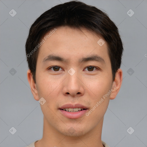 Joyful asian young-adult male with short  brown hair and brown eyes