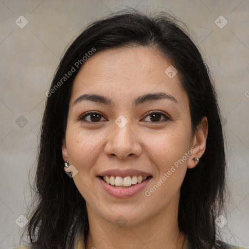 Joyful latino young-adult female with long  brown hair and brown eyes