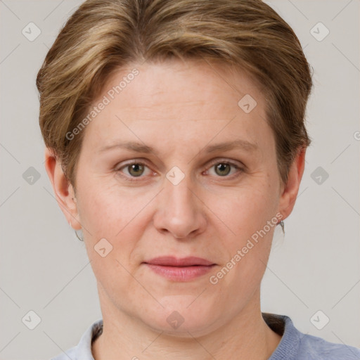 Joyful white adult female with short  brown hair and grey eyes