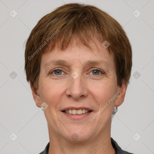 Joyful white adult female with short  brown hair and grey eyes