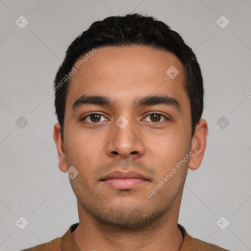 Neutral latino young-adult male with short  black hair and brown eyes