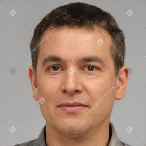 Joyful white adult male with short  brown hair and brown eyes