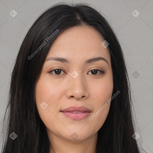 Joyful asian young-adult female with long  brown hair and brown eyes