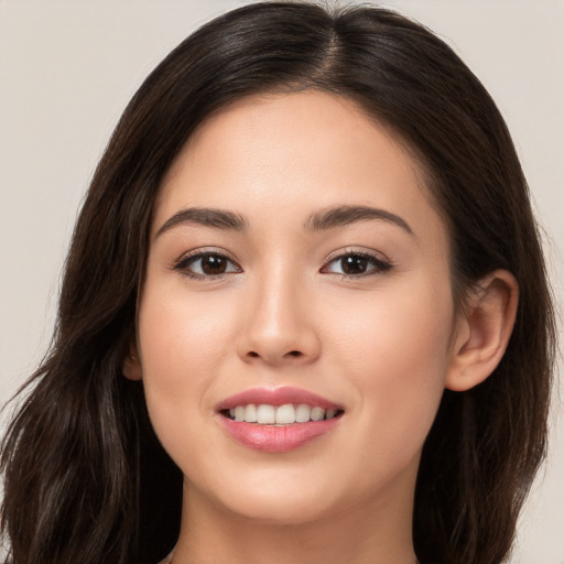 Joyful white young-adult female with long  brown hair and brown eyes