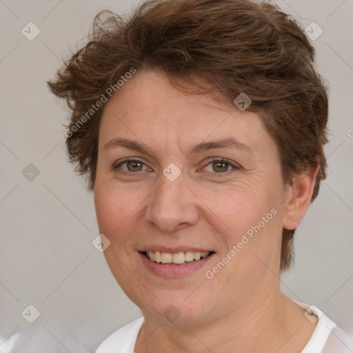 Joyful white adult female with short  brown hair and brown eyes