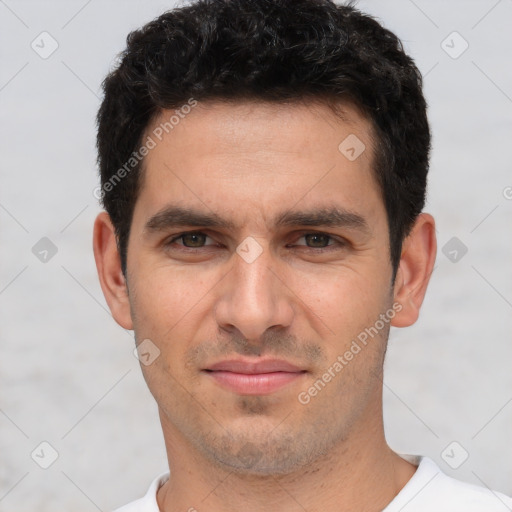 Joyful white young-adult male with short  black hair and brown eyes